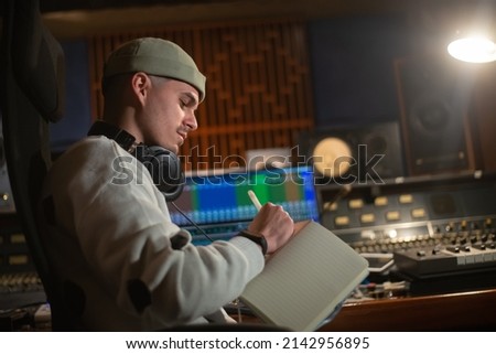 Similar – Image, Stock Photo Working sound engineer wearing headphone in home studio.