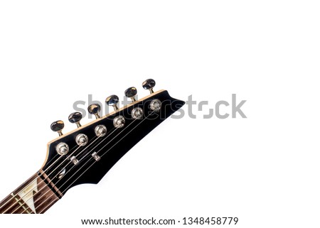 Similar – Image, Stock Photo A black guitar head with the golden tuning pegs and the plastic and metal sides attached to the white screws. A small part of the fingerboard is still visible.