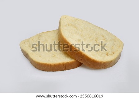 Similar – Image, Stock Photo Bread sliced in two held in womans hands. Sourdough bread