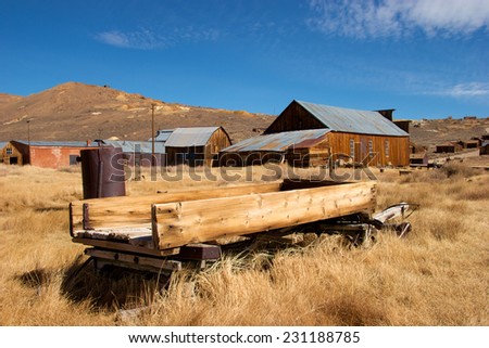 Historic ghost town of Bodie with old hay wagon in the foreground