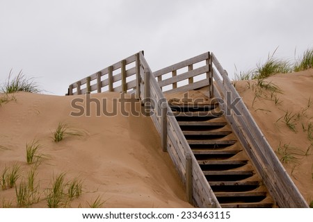 Wooden stairs going up over the dunes to the beach. Prince Edward Island National Park, on the north shore of Prince Edward Island, Canada