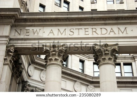 The words New Amsterdam, original name of New York, engraved in stone in building, lower Manhattan, New York