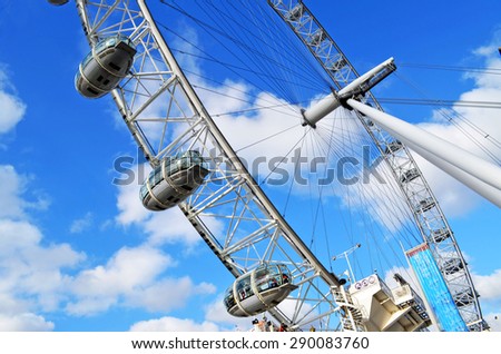 GREAT BRITAIN, LONDON - FEBRUARY 4, 2015: London Eye with cloudy blue sky