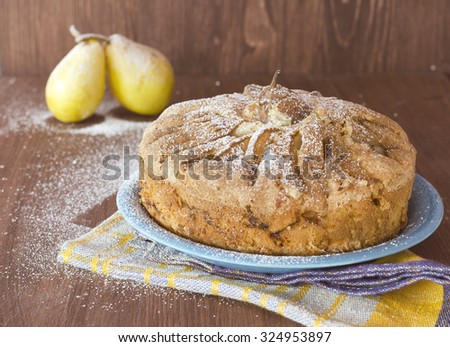 Pear pie with pears on the wooden background,  selective focus, toned photo