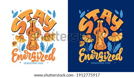 The vector illustration with a cat in headstand pose has lettering phrase - Stay Energized. The cartoon design is good for sport and yoga t-shirts.