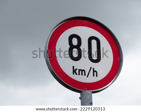 A road sign limiting the speed of 80 km per hour. A road sign against a sky. Stok fotoğraf © 