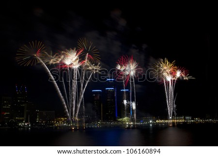 Detroit\'s Target Fireworks June 25th 2012 on the Detroit River celebrating the 4th of July. The skyline of Detroit and the Renaissance Center are seen behind the fireworks.