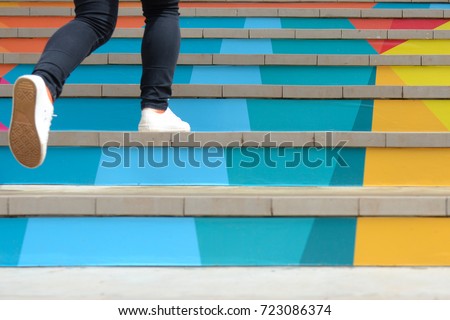 Lower part of teenage girl in casual shoe walking up outdoor colorful stair,teenage lifestyle successful concept Сток-фото © 