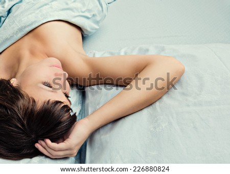 Portrait of beautiful woman in the bedroom