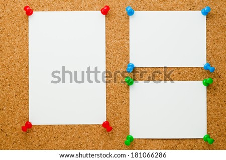 Pieces of paper on the cork board
