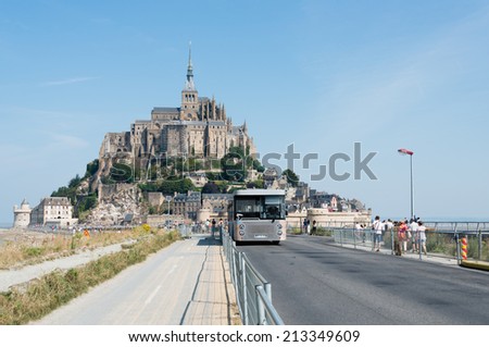 LE MONT SAINT-MICHEL, FRANCE - JULY 26, 2014: A shuttle bus used to access the Mont Saint-Michel. Shuttle buses are only vehicles allowed to approach this World Heritage Site.