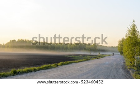 Image, Stock Photo Car riding along dirty road in evening forest