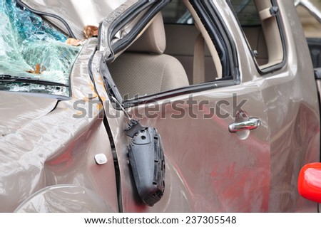Generic compact car damaged in a rollover accident. Car crash wreck - insurance concept.
