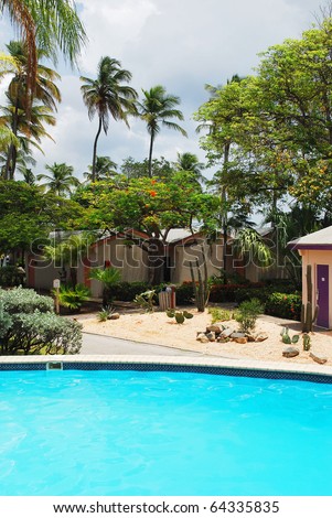 Luxury Resort Pool and hotel garden in Aruba.