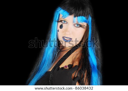 Halloween. Fashion portrait of nigh  Gothic style  sad witch  woman.  On the black background.
