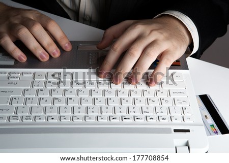 human hands on the notebook keyboard close-up