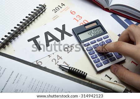 office work and filling in tax returns close up