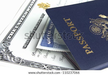 Blue American passport with citizenship documents on white background.