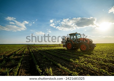 Similar – Foto Bild Traktor auf Feld in Abendsonne