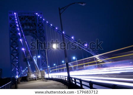 Traffic light trails at George Washington Bridge in New York City.  George Washington Bridge is a double-decked bridge that connects New York City and New Jersey.