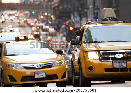 New York City, USA - July 11, 2014: Yellow taxi at 42nd street in New York City during afternoon.