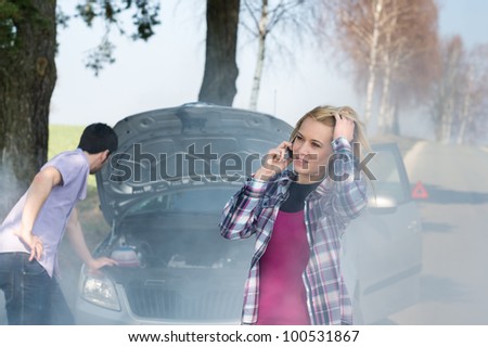 Car breakdown woman call for help road assistance smoking engine