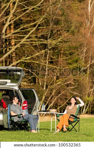 Camping car happy couple enjoy sun relax picnic in countryside