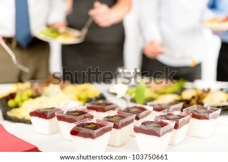 Appetizers mini desserts on catering buffet white tablecloth