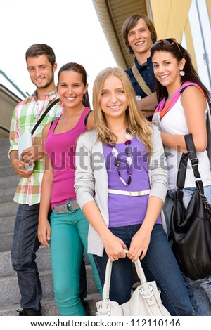 Students back to school on college stairs teens standing smiling