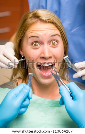 Scary dental tools crazy woman patient at the dentist