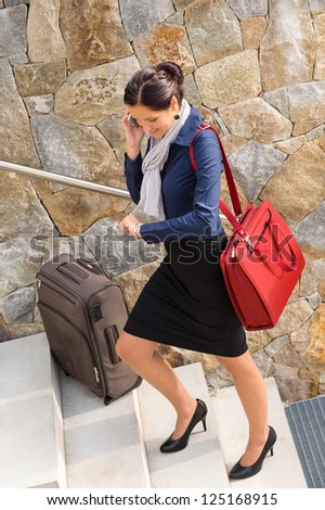 Traveling businesswoman hurried rushing climbing baggage carry-on shoulder bag