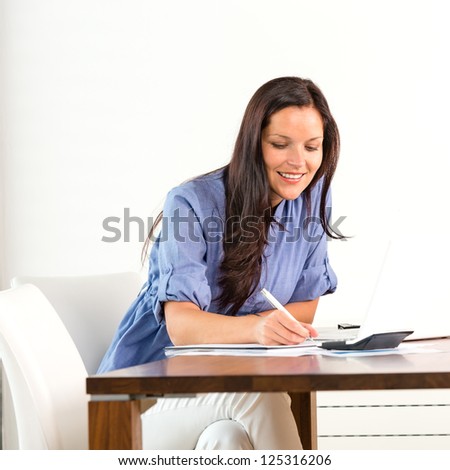 Smiling woman researching library university exam writing essay