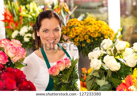 Smiling florist flower shop colorful making bouquet roses market