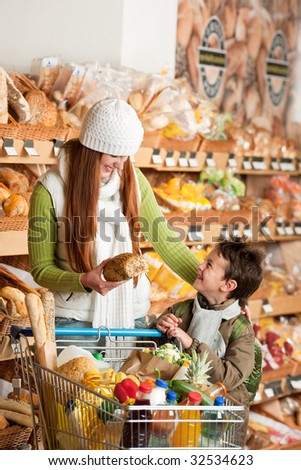 Grocery store - Red hair woman with little boy in a supermarket
