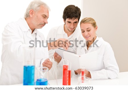 Chemistry experiment -  scientists in laboratory testing vaccination