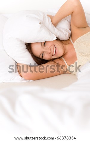 Bedroom - lazy woman getting up blocking ears