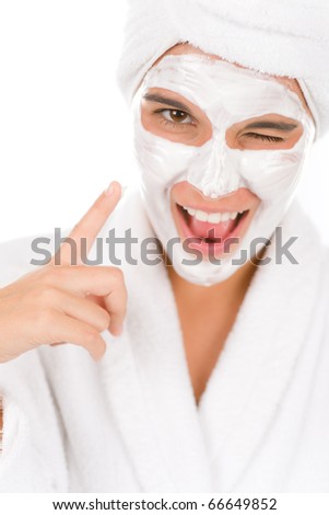 Teenager facial mask - happy woman on white background