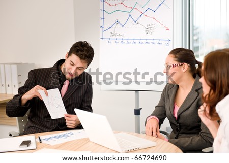 Business meeting - group of people in office at presentation