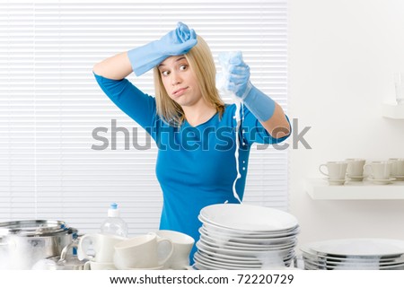 Modern kitchen - frustrated woman washing dishes, housework