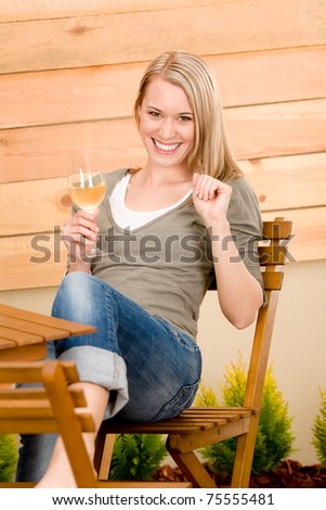 Garden happy woman enjoy glass wine on terrace