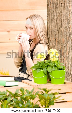 Garden woman terrace enjoy rest with cup coffee plant