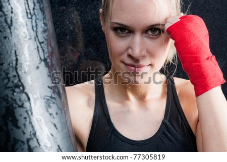 Boxing training blond woman sparring and sweating
