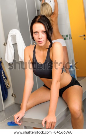 Locker room young sportive woman outfit sitting fitness training