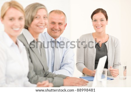 Business team attractive businesswomen with happy colleagues working around table