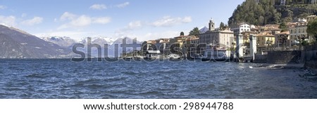 Bellagio lake of Como, Italy - April 1, 2015: Dock of Bellagio with nineteenth-century historic homes. The beautiful day is due to the wind from the north.