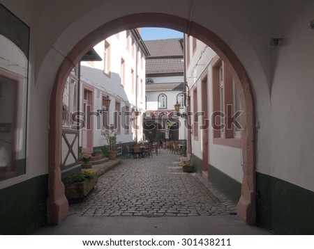 Neustadt an der Weinstrasse, Germany - April 19, 2015: Small courtyard in a house in the old town pedestrian.