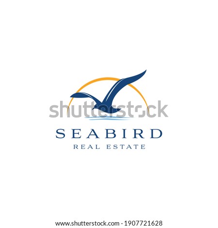 Seabird real estate logo design. Seagull luxury property template vector symbol. Sea Bird fly silhouette sign Stock foto © 
