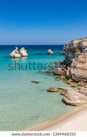 Similar – Image, Stock Photo The Two Sisters stacks in front of the shore of Torre dell’Orso