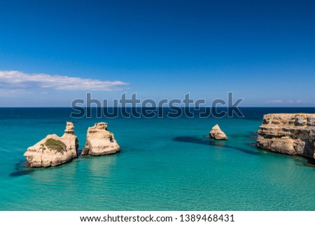 Similar – Image, Stock Photo The Two Sisters stacks in front of the shore of Torre dell’Orso