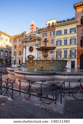 two fountains from old bathtub in square if front of embassy of France. Rome. Italy.